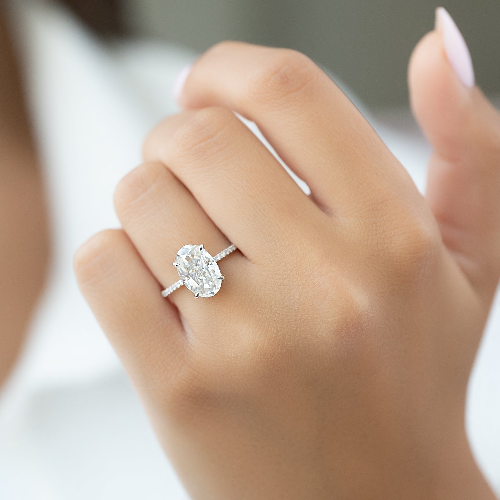 Oval Cut Diamond Engagement Ring with Pavé Diamond Band