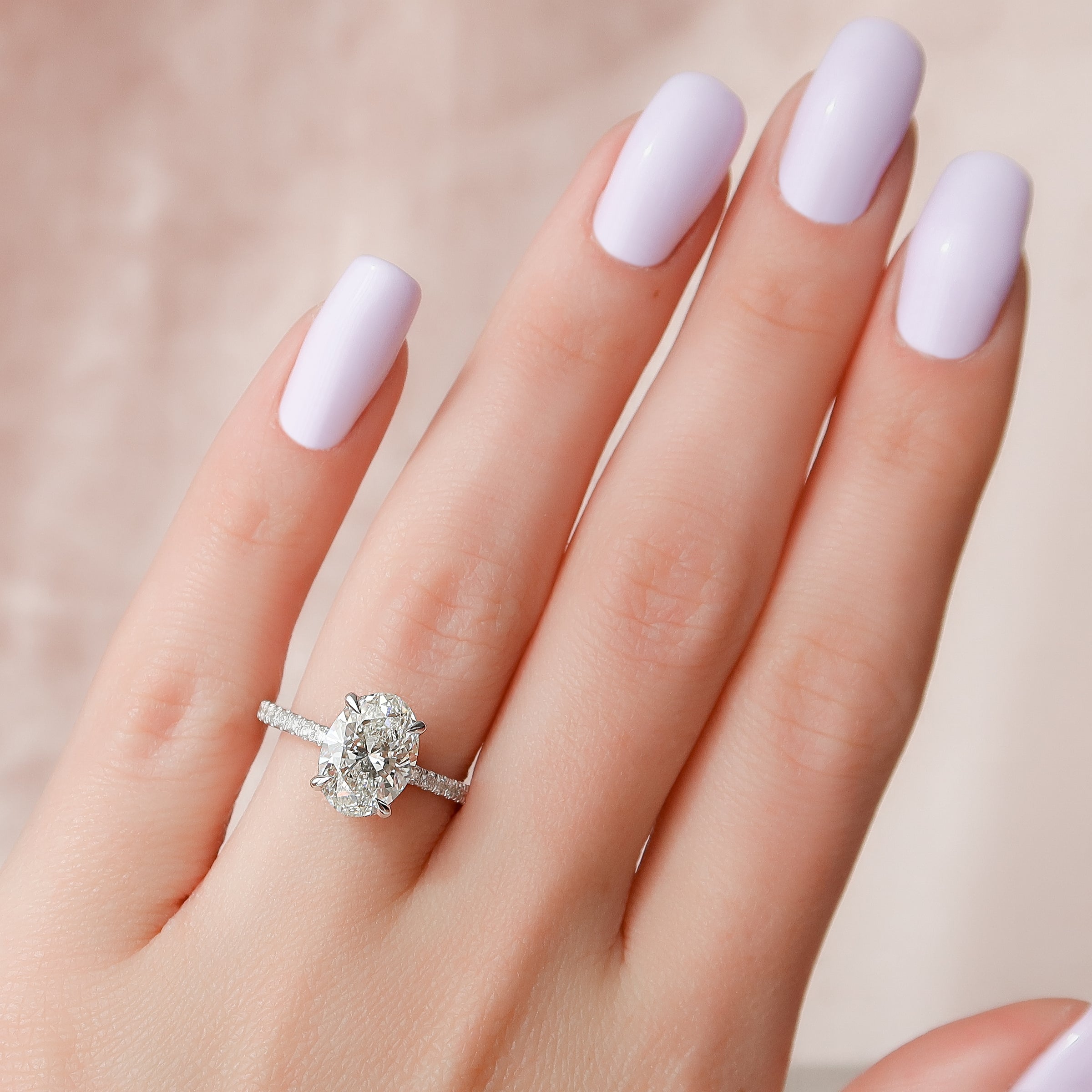 Oval Cut Diamond Engagement Ring with Pavé Diamond Band