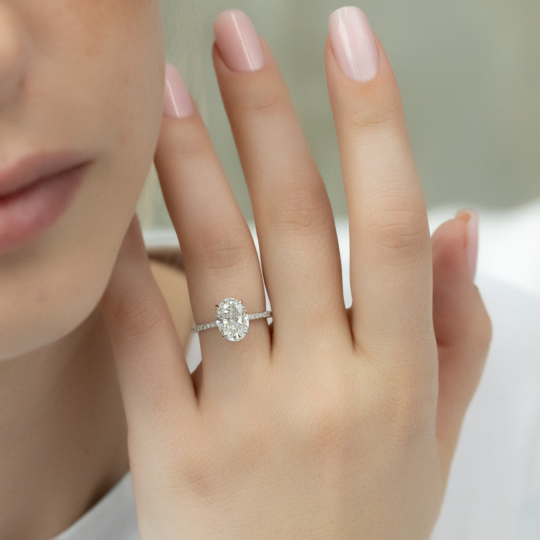 Oval Cut Diamond Engagement Ring with Pavé Diamond Band