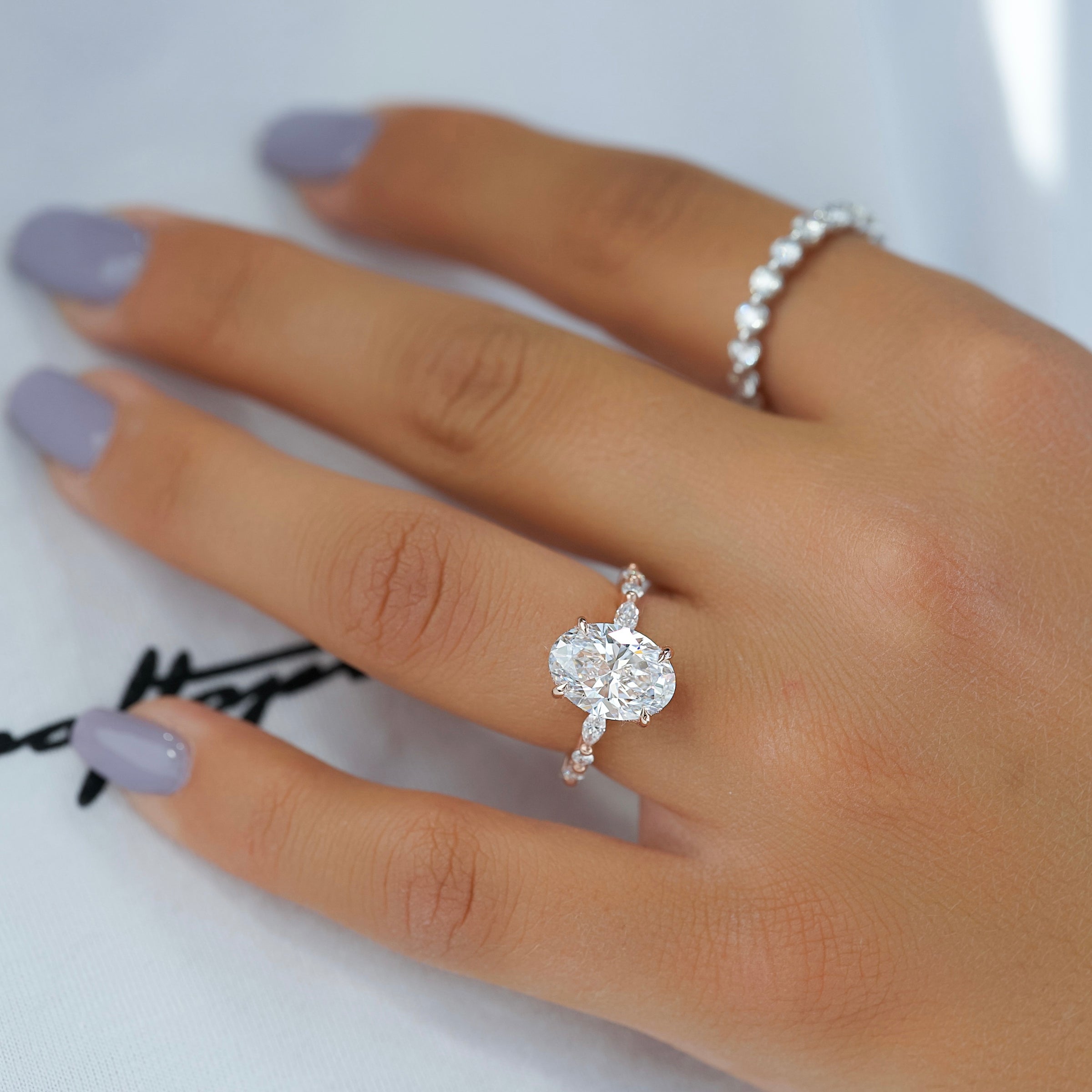 Oval Cut Diamond Engagement Ring in Rose Gold with Pavé Accent Stones