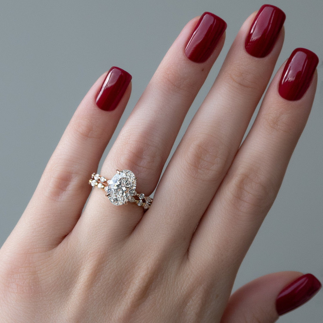 Oval Cut Diamond Engagement Ring in Rose Gold with Pavé Accent Stones