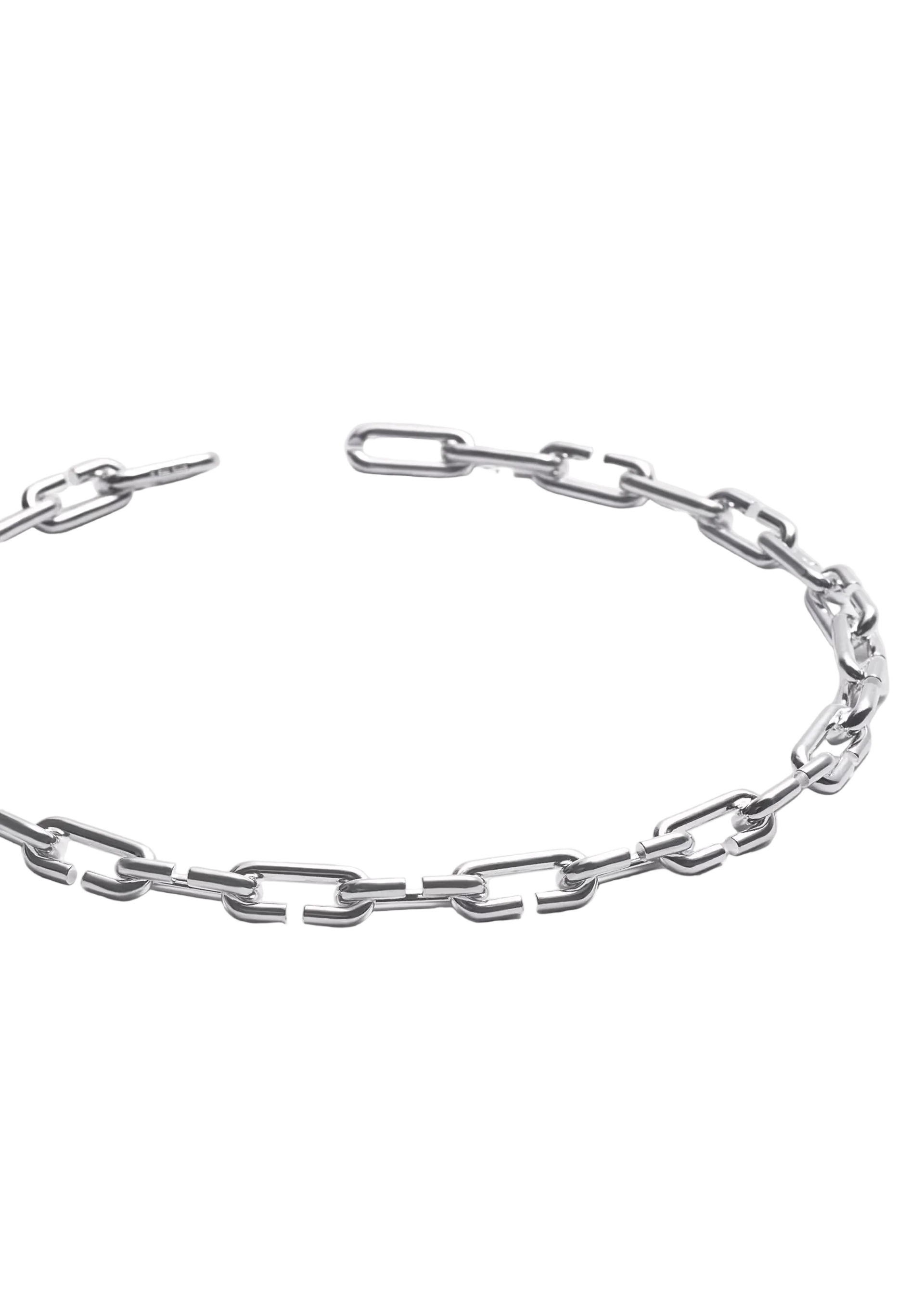 A silver-toned metal chain link bracelet with a chunky, elongated link design, displayed in a curved shape on a light gray background.