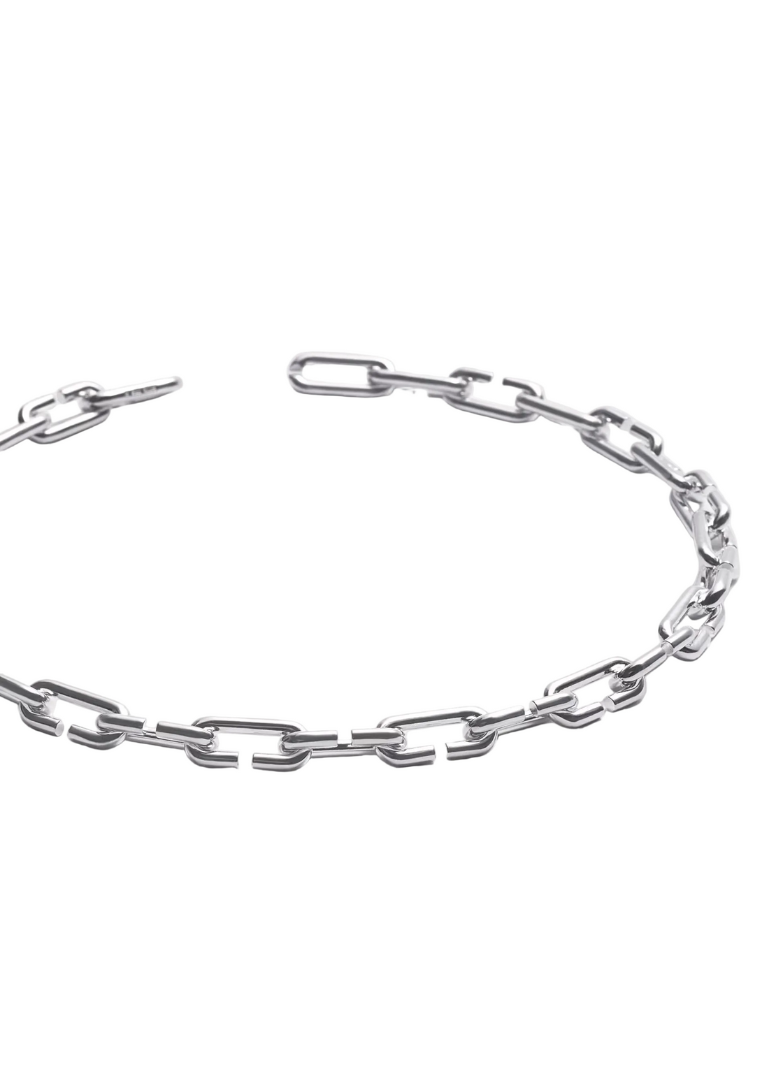 A silver-toned metal chain link bracelet with a chunky, elongated link design, displayed in a curved shape on a light gray background.