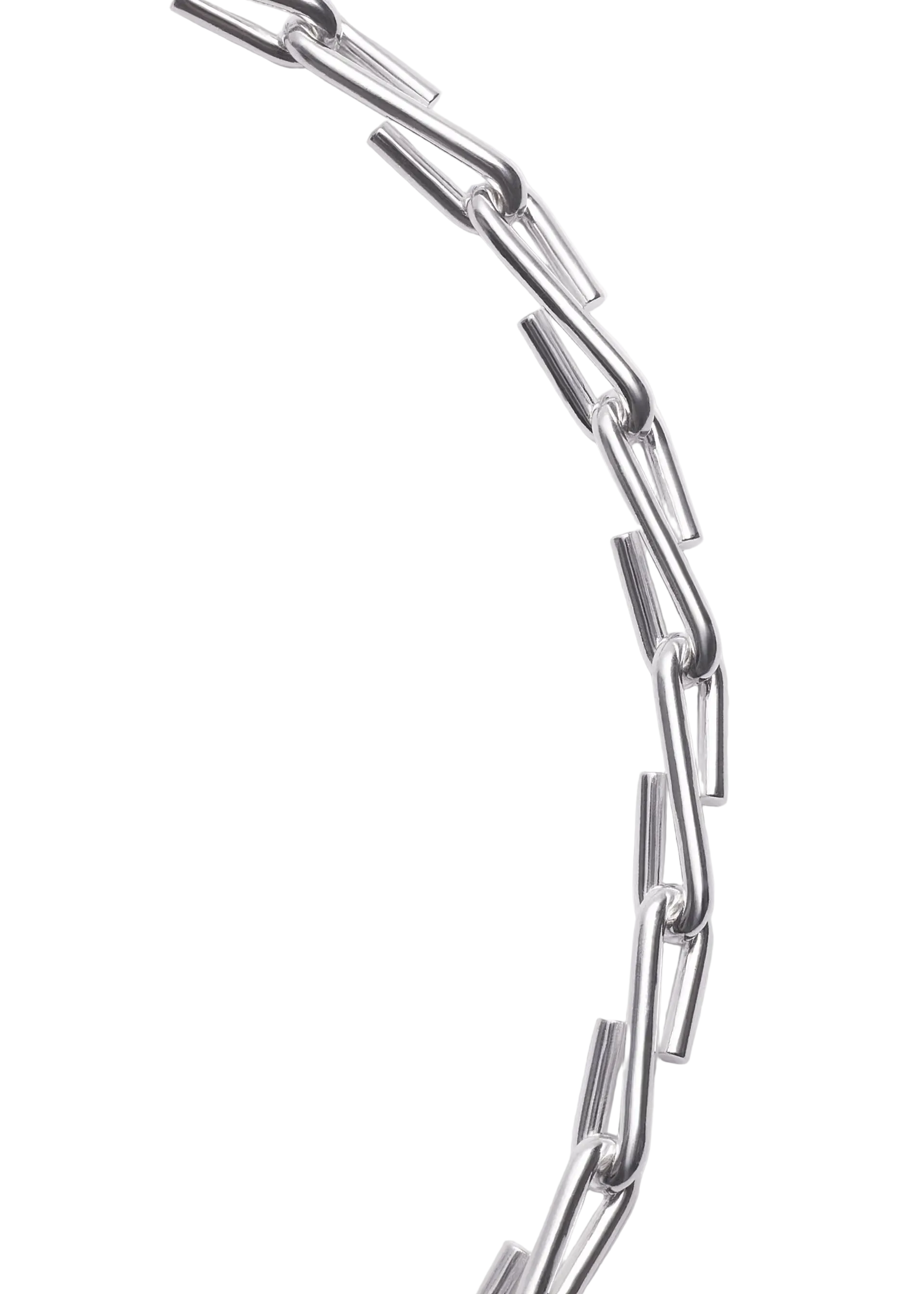 A close-up of a chunky silver chain necklace with elongated, geometric links, photographed against a clean, light gray background.