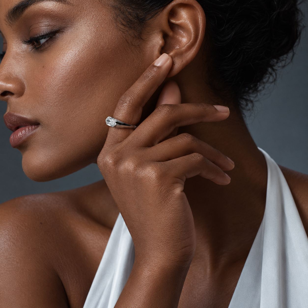 Woman wearing an elongated hexagon lab-grown diamond signet ring