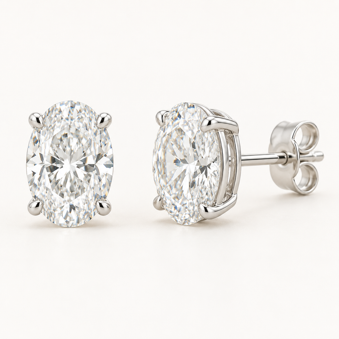 Oval-cut lab-grown diamond stud earrings, front and side views