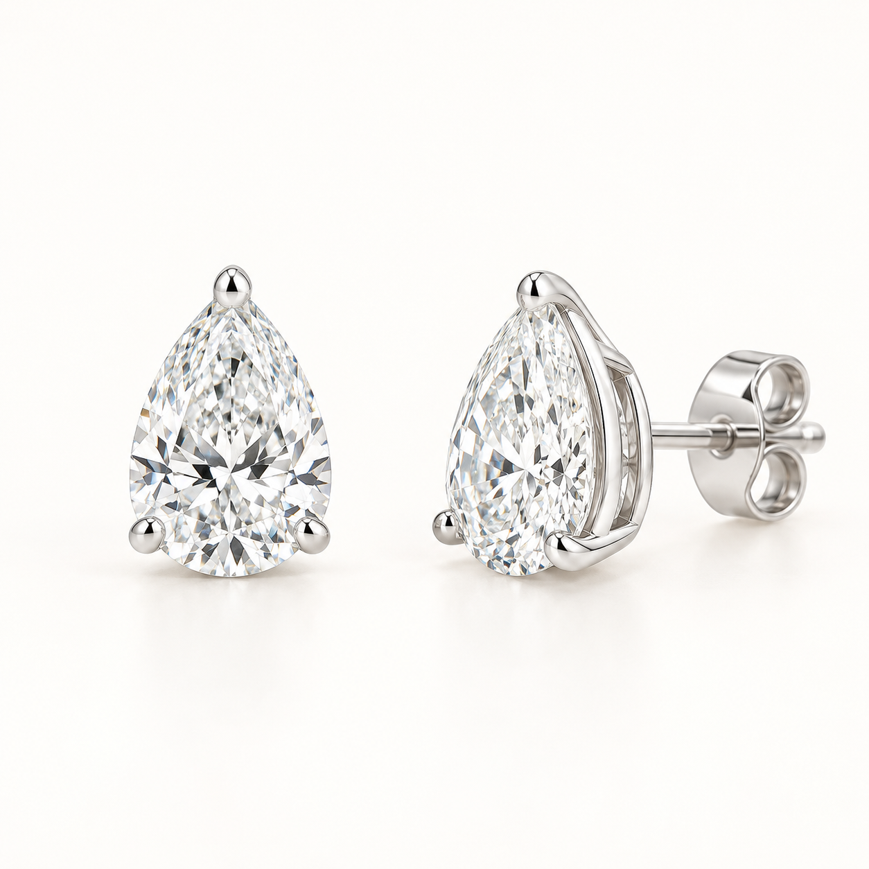 Pear-cut lab-grown diamond stud earrings, front and side views