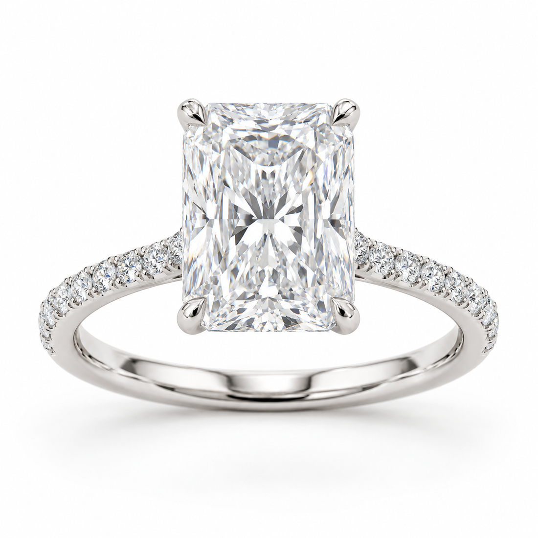 Radiant-cut lab-grown diamond solitaire engagement ring with four-prong setting and pavé band